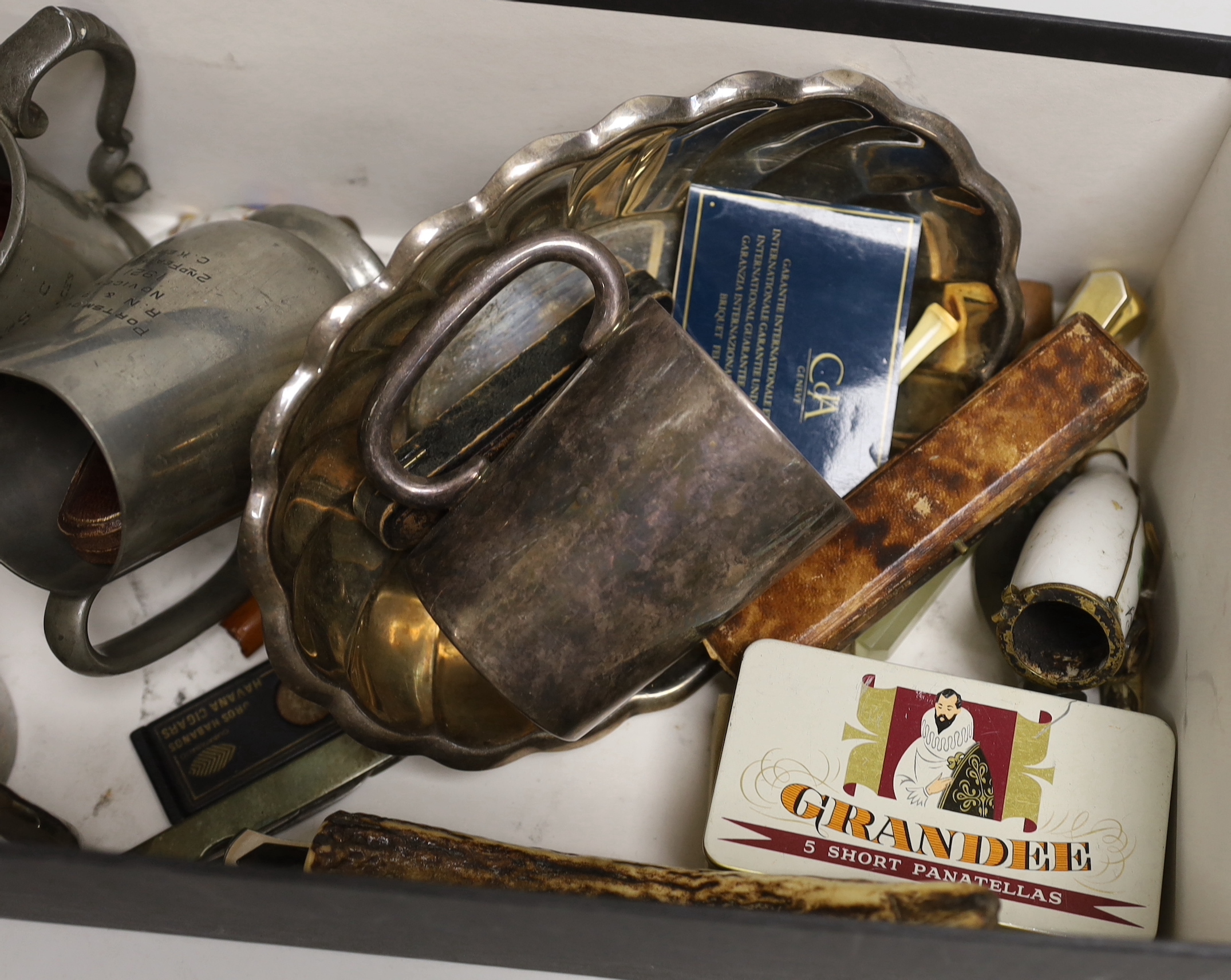 A group of assorted smoker's accoutrements and plated mugs